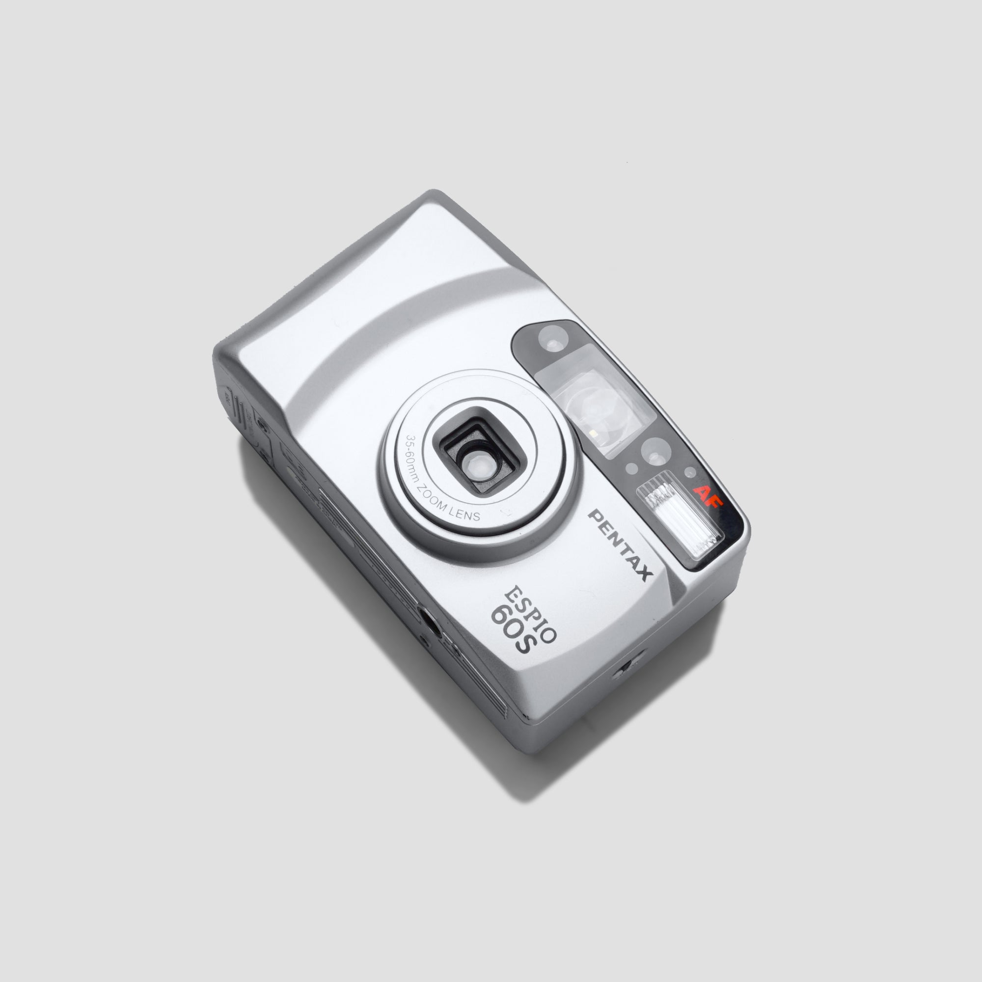 Pentax Espio 60s compact film camera at an outdoor event, showcasing its sleek design and functionality.