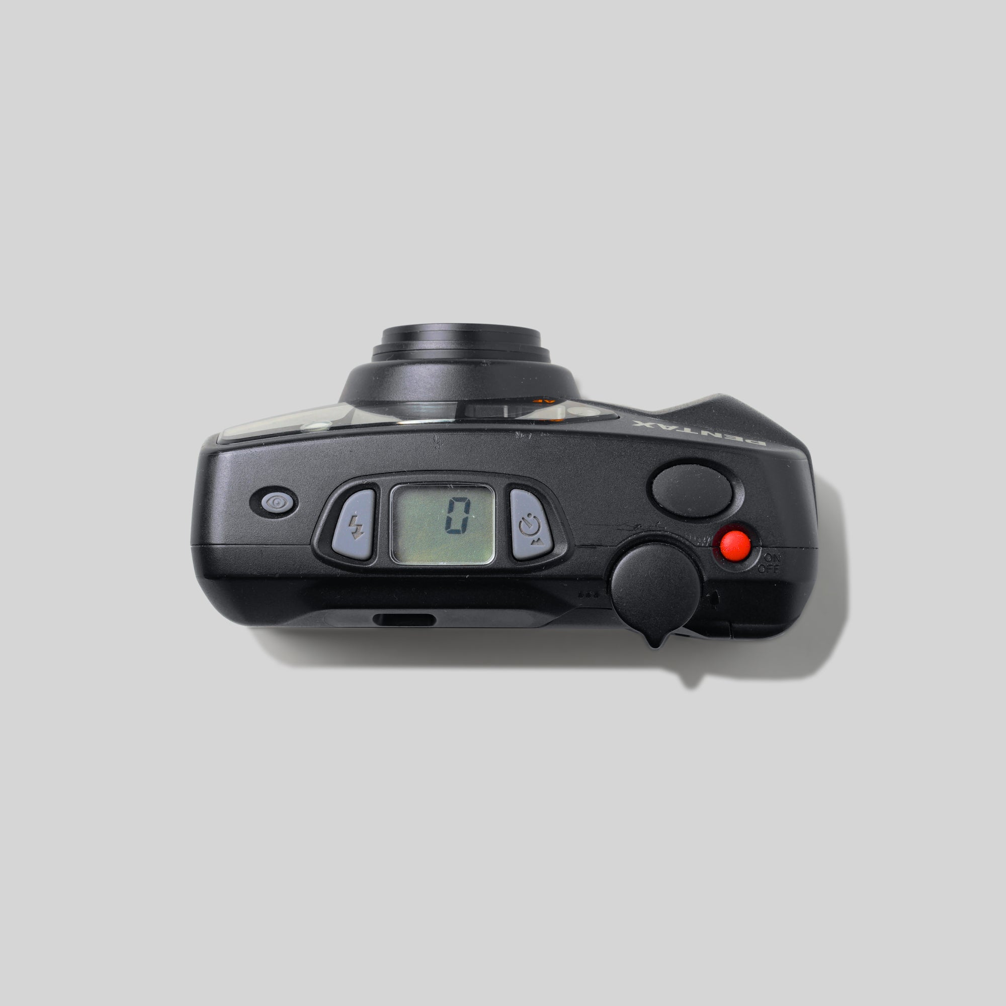 Close-up of the Pentax Espio 738Gs control panel and lens