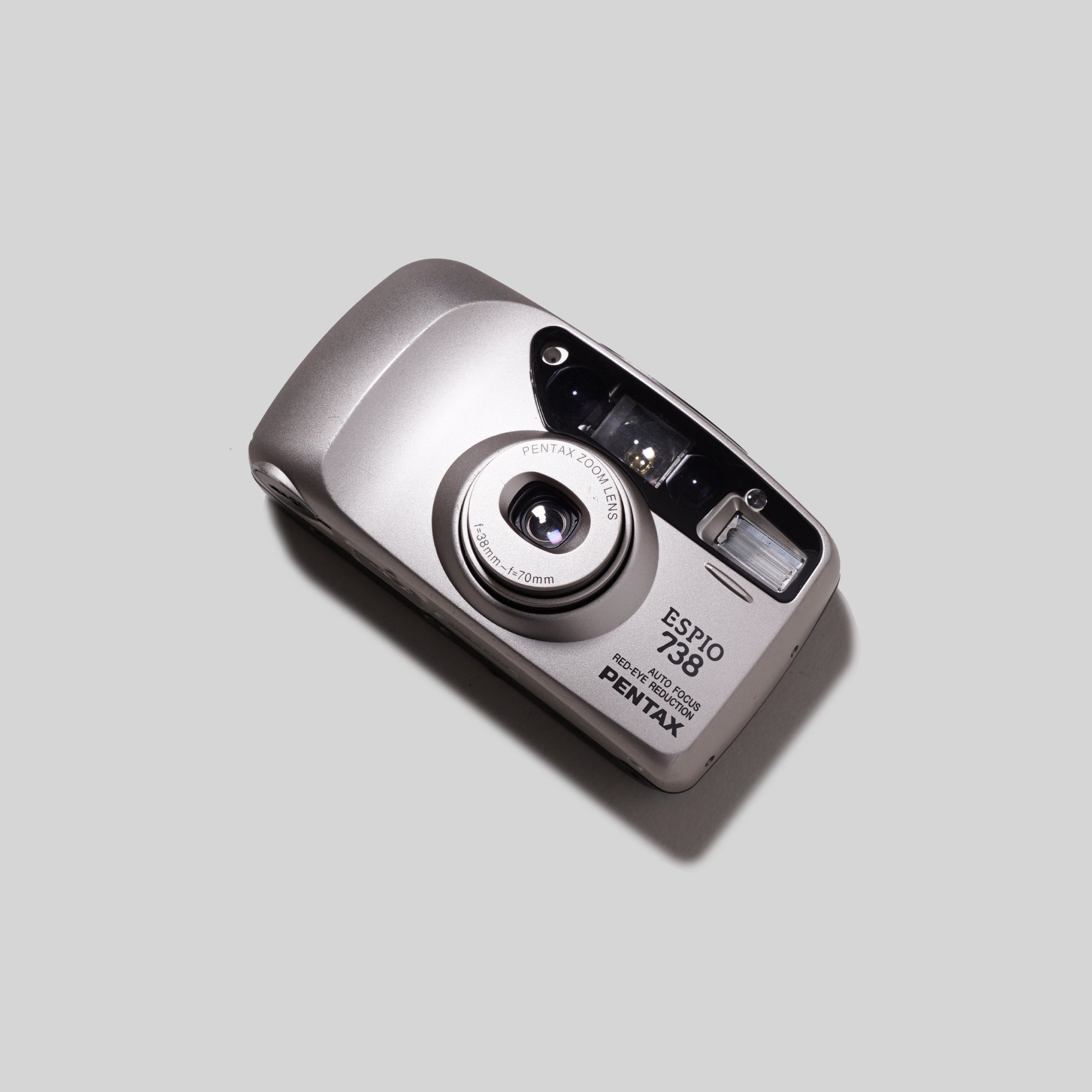 Front view of the Pentax Espio 738 Grey showing its compact design and zoom lens