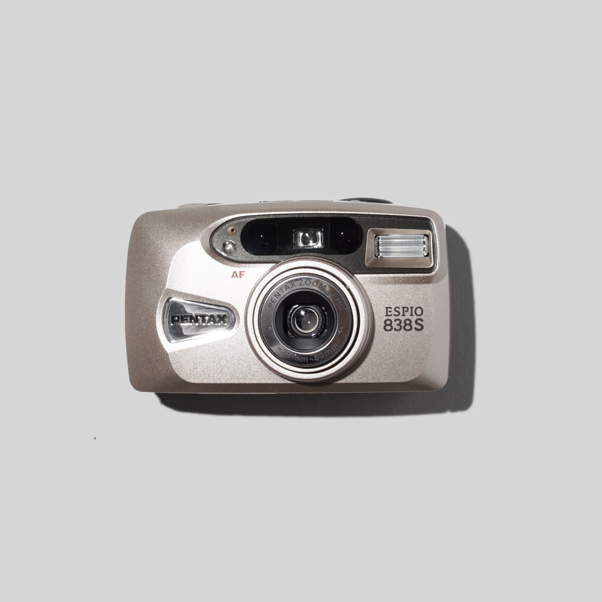 Front angle of Pentax Espio 838s showcasing its compact build and zoom lens