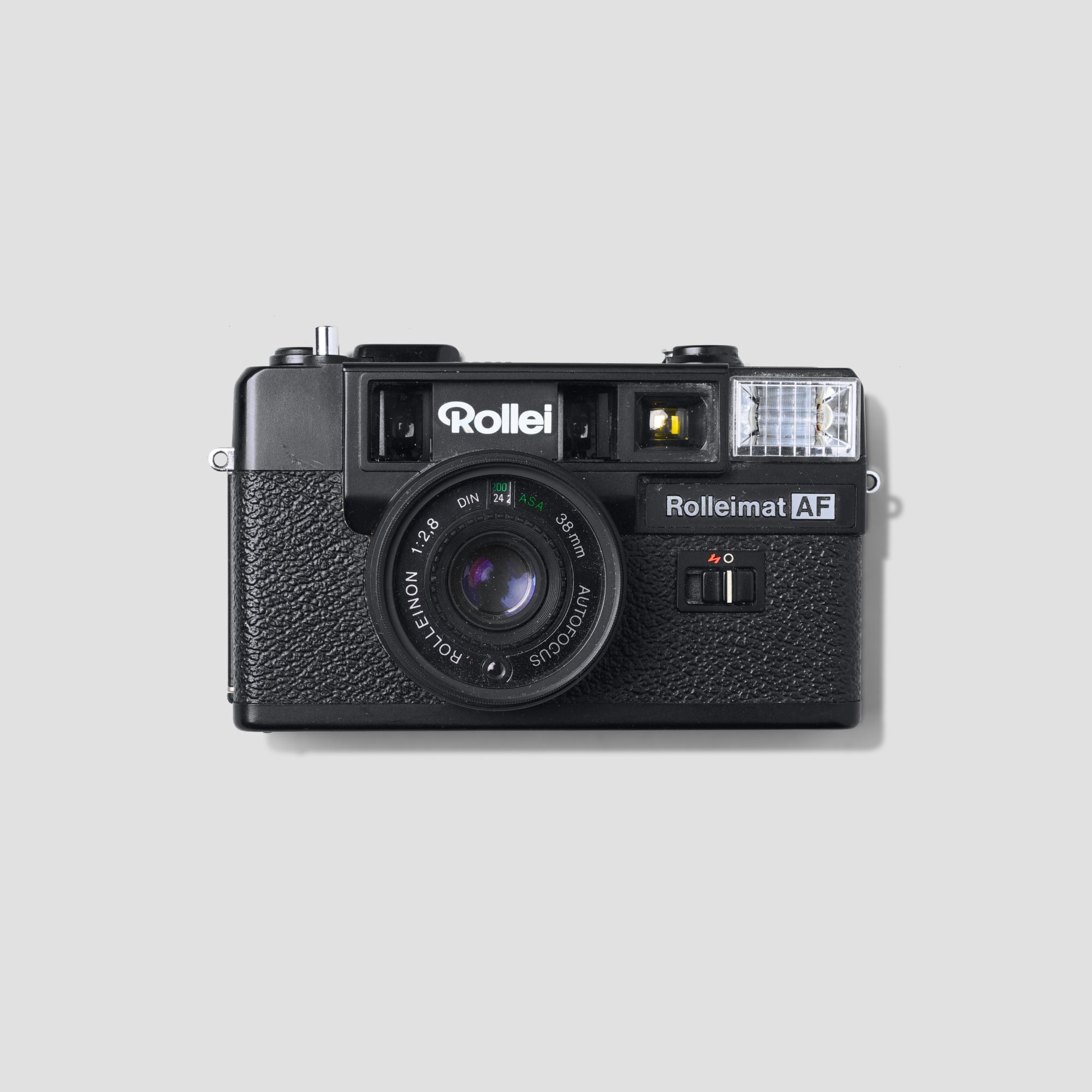 Front view of the Rollei Rolleimat AF vintage camera showing its 38mm Rolleinon lens