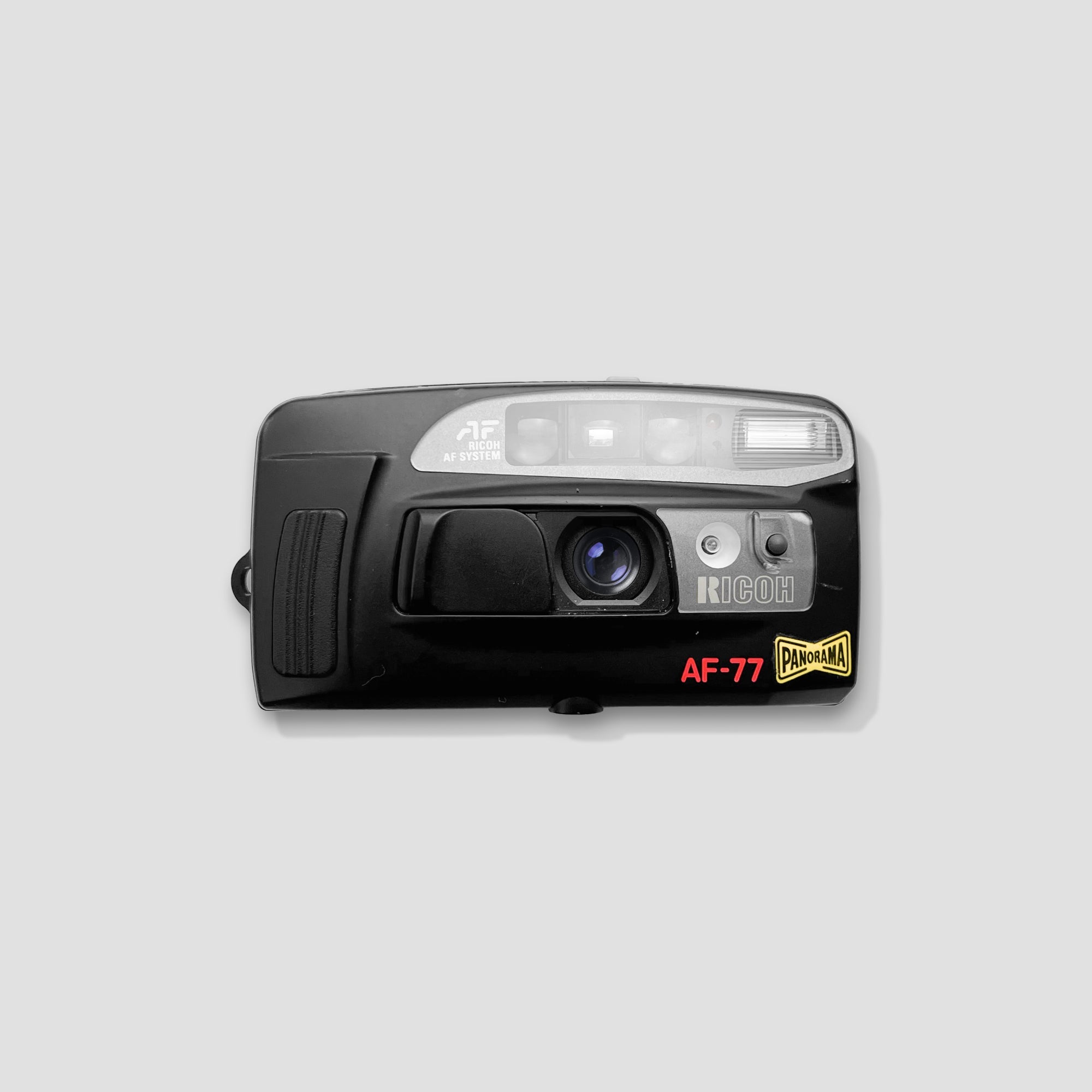 Ricoh AF-77 film camera from the front with panorama function visible