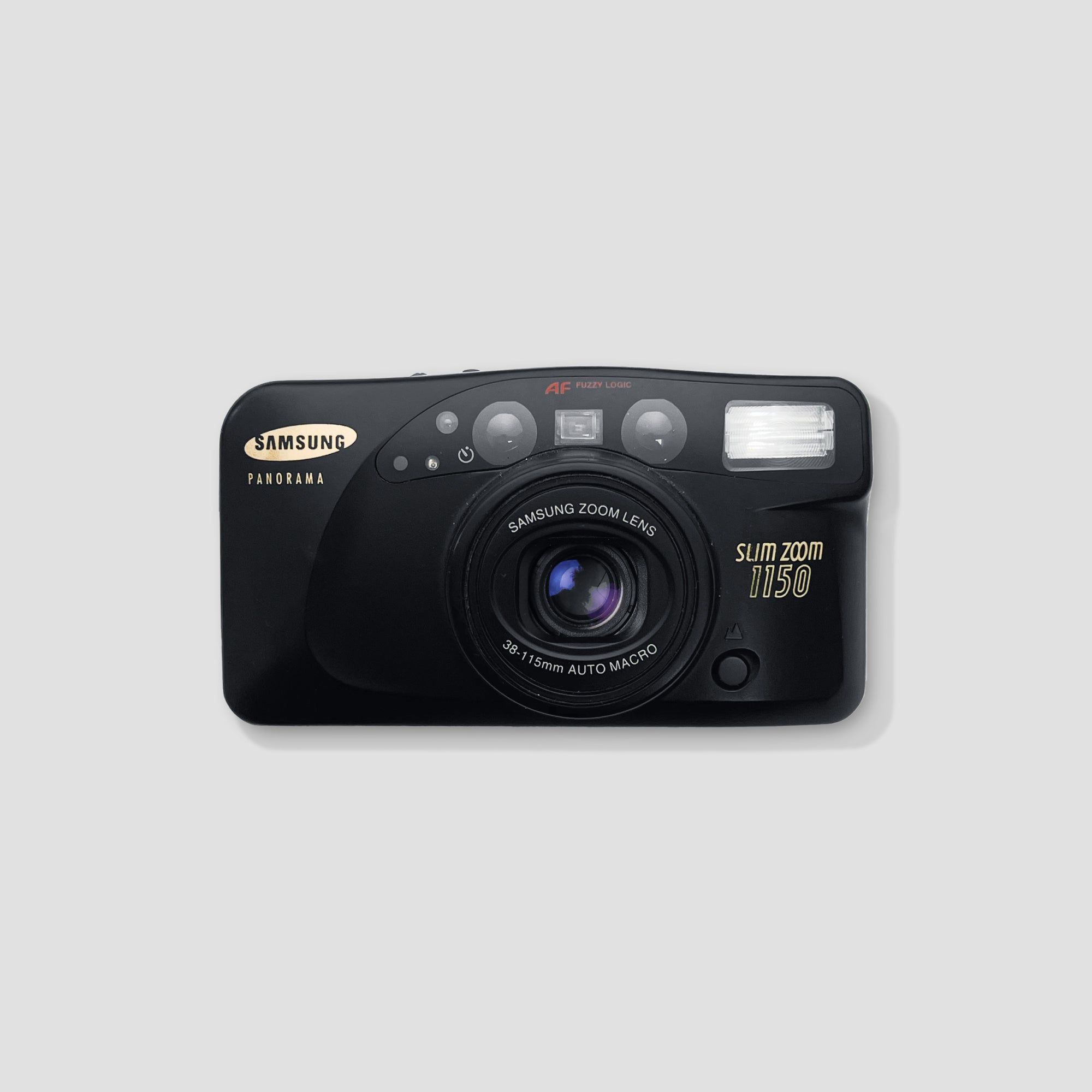Close-up of Samsung Slim Zoom 1150 camera showing the zoom lens in action.