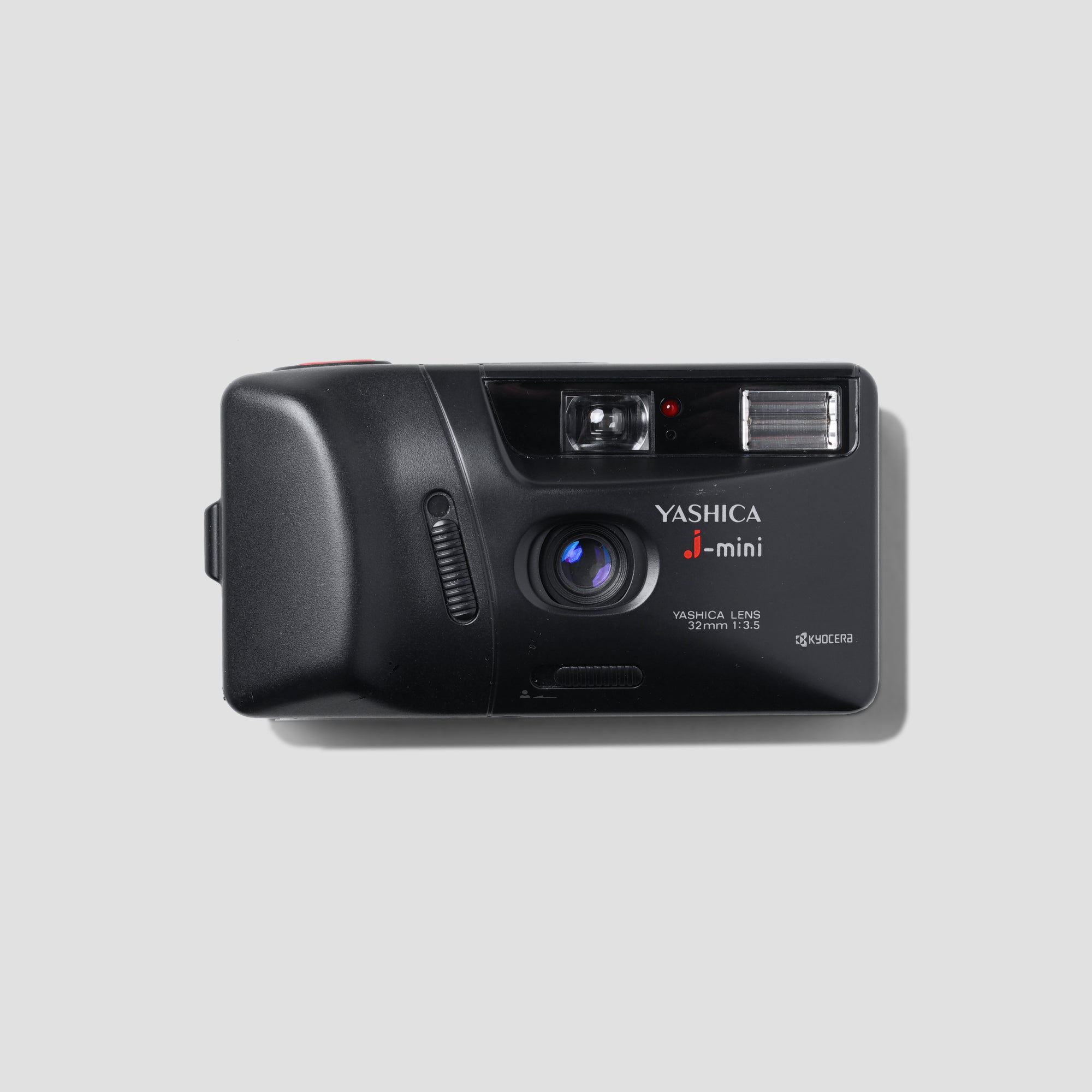 Yashica J-Mini camera front view, showcasing its sleek design and compact size.