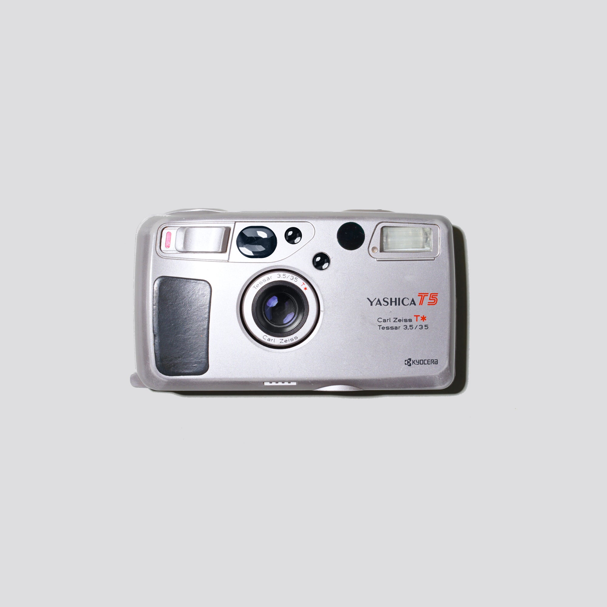Front view of Yashica T5 Grey showing Carl Zeiss lens and compact body – 35mm camera